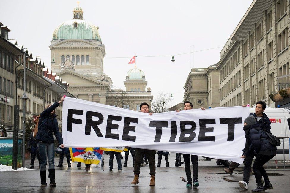 Pro-Tibet protestors hold a banner reading "Free Tibet" during a demonstration, prior to the state visit of Chinese President Xi Jinping in Bern, Switzerland, 15 January 2017.