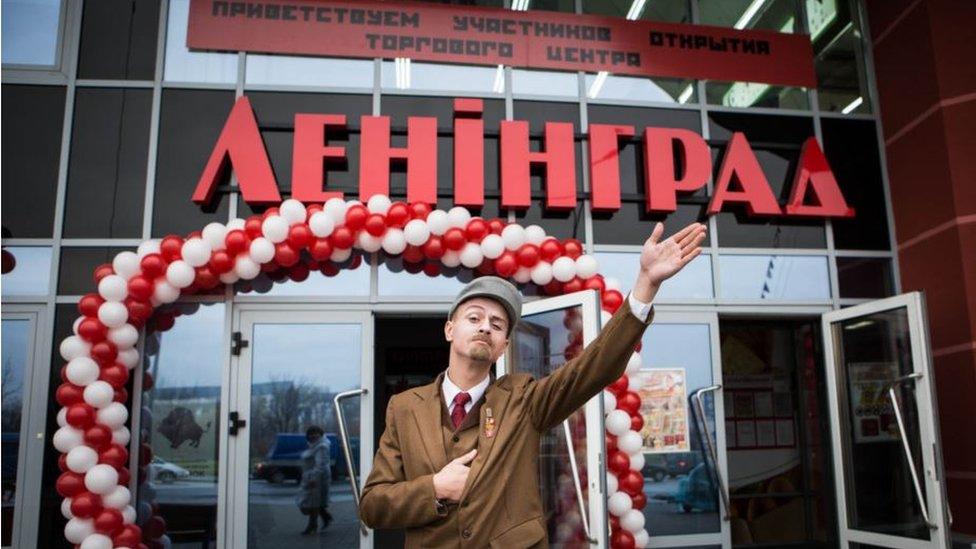 An actor dressed as a young Vladimir Lenin outside the Leningrad centre