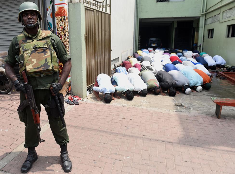 A soldier guards a mosque in Colombo in 2018, at the time of the Kandy riots