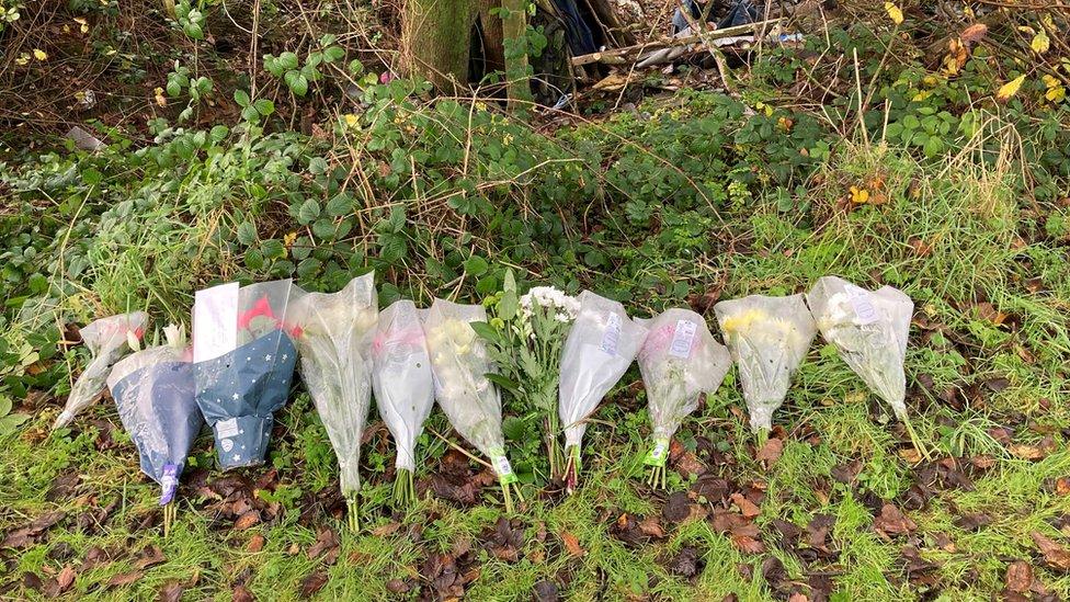 Floral tributes left at the site