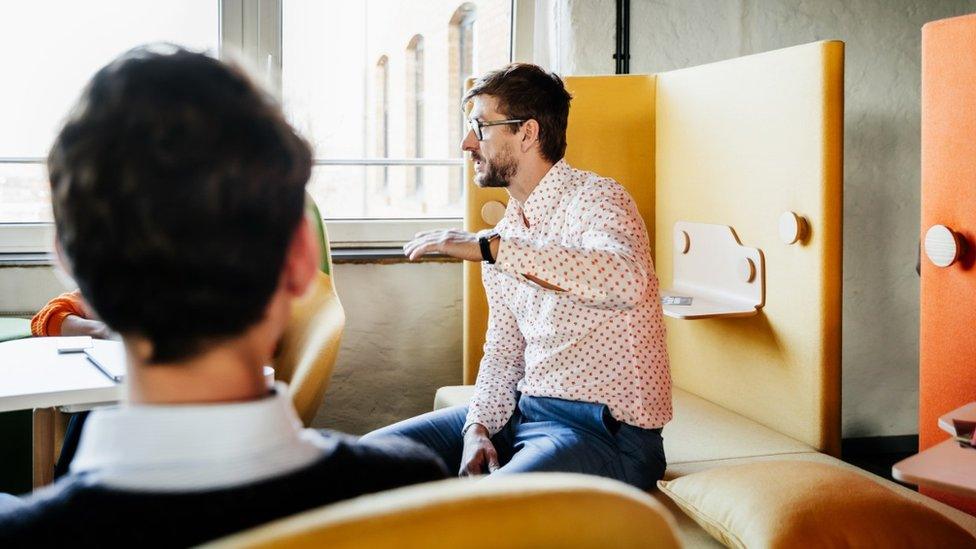 White men in a meeting (stock image)