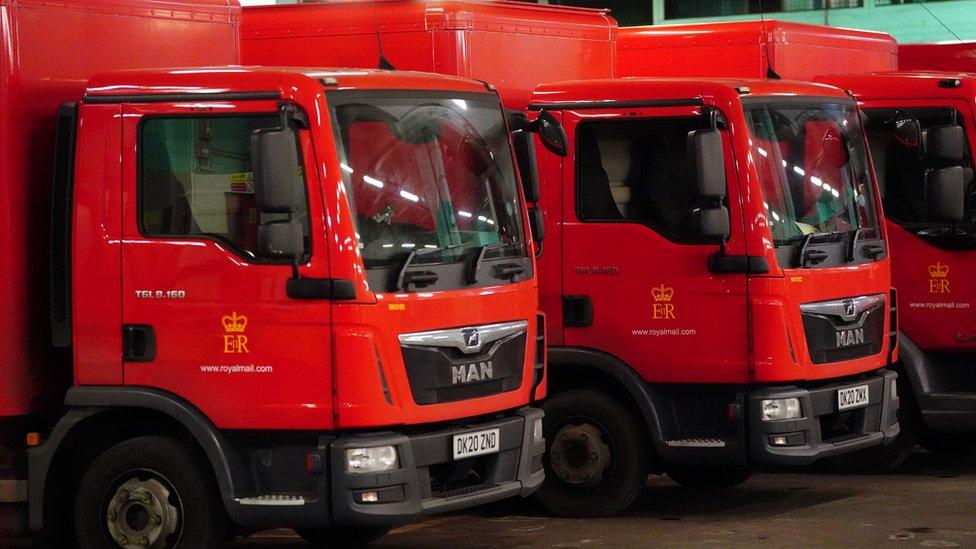 Royal Mail vans parked up in a delivery office