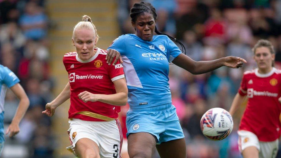 Maria Thorisdottir of Manchester United and Khadija Shaw of Manchester City in action.