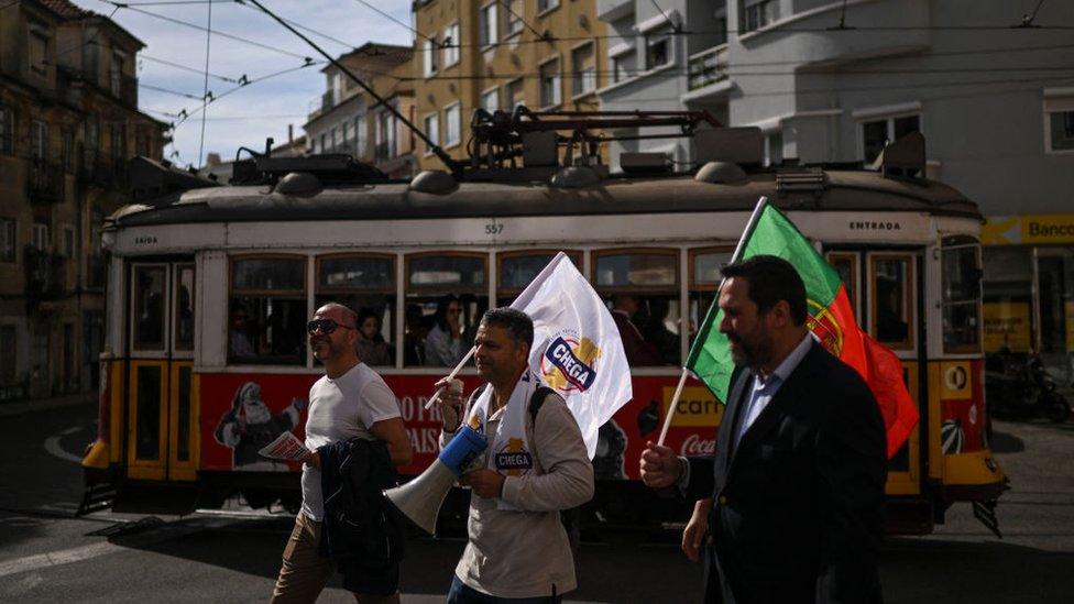 People carry Chega flags in Lisbon