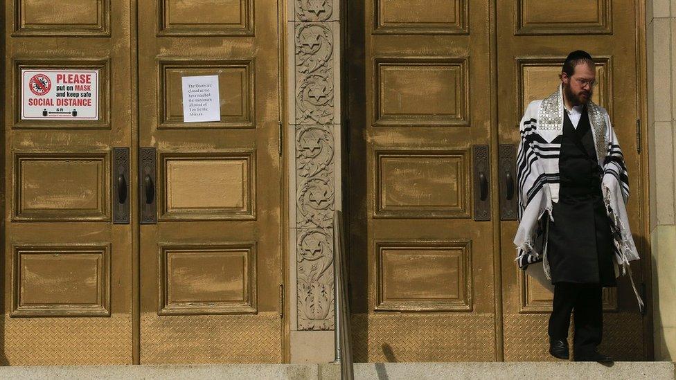 A man leaves the closed Young Israel Beth-El of Boro Park Synagogue on October 10, 2020 in the Brooklyn borough of New York City