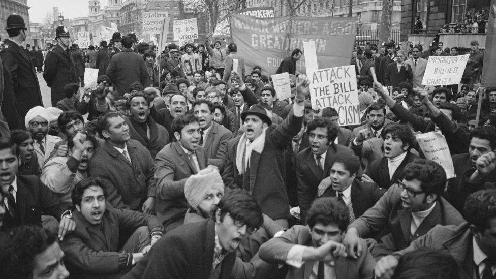 Protesters at a rally against the 1971 Immigration Act