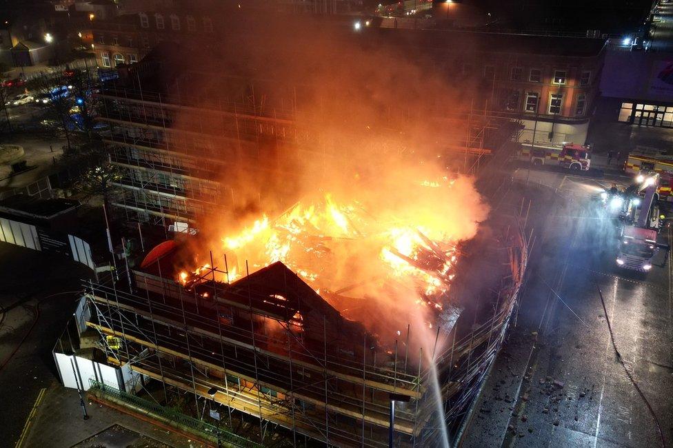 The roof of Wesley Chapel on fire