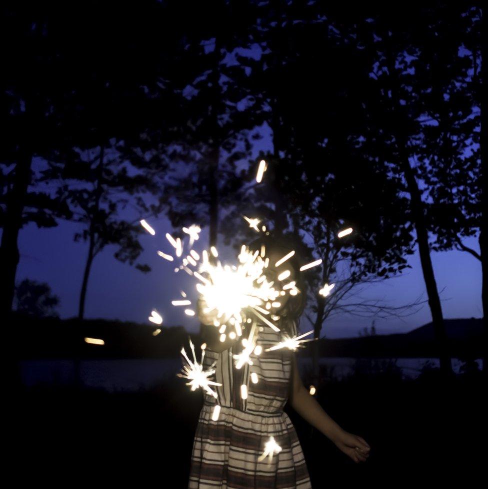 A child with a sparkler