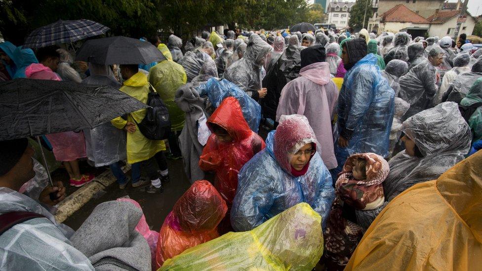 Migrants wait to be registered at the registration camp in Presevo, Southern Serbia, 7 October 2015