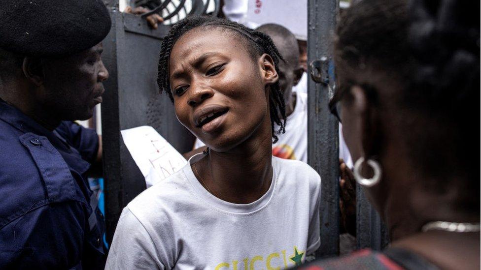 A voter pushes through the crow into a polling station in Kinshasa on December 20, 2023.