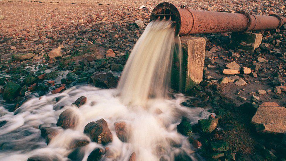 An outlet pipe discharges sewage onto a North Sea beach in Hartlepool