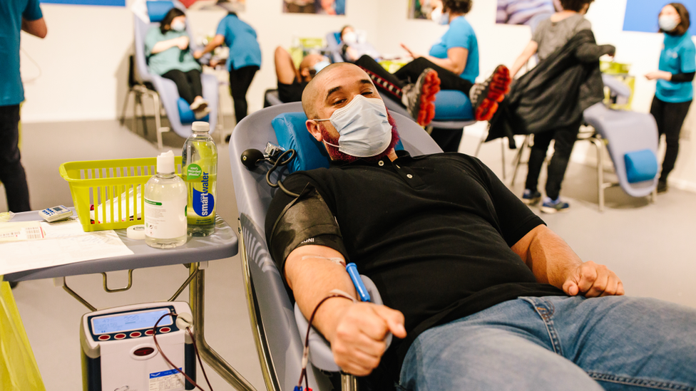 Donor has blood taken at a centre.