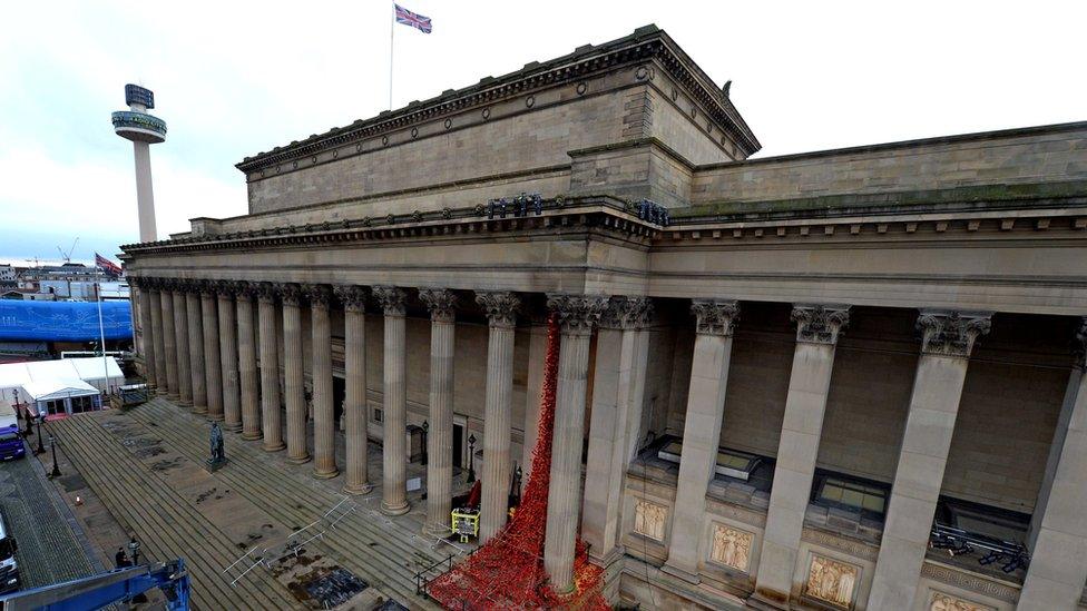 Ceramic poppies cascade down St George's Hall