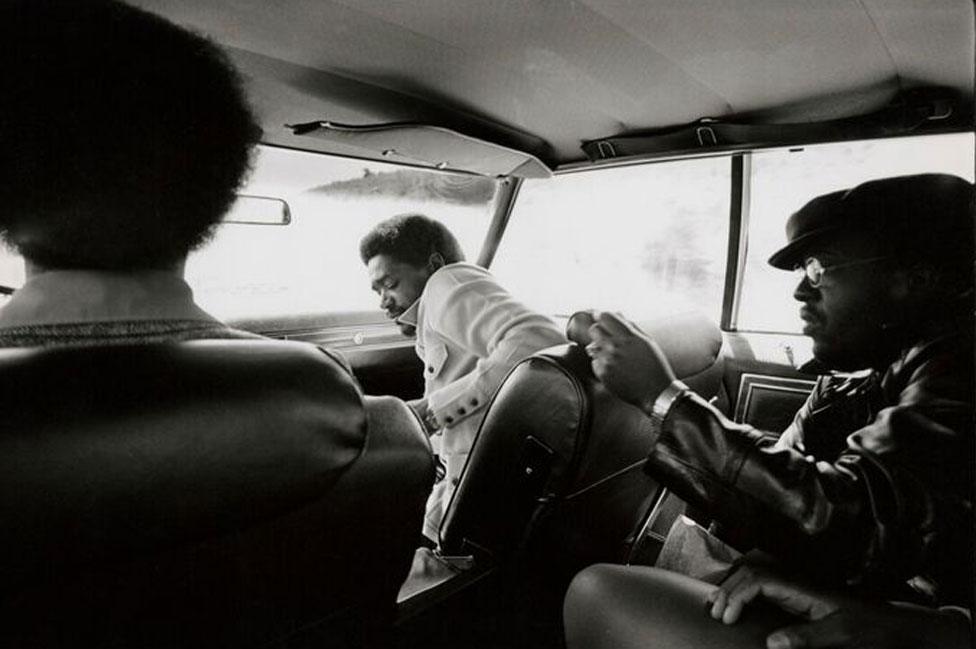 Bobby Seale, in front passenger seat, with other Black Panthers