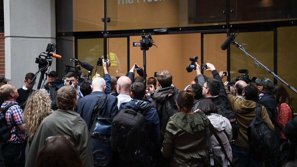 Journalists wait to gain access to the Kensington and Chelsea council meeting