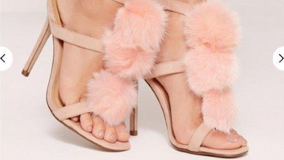 These shoes have cat fur pom poms