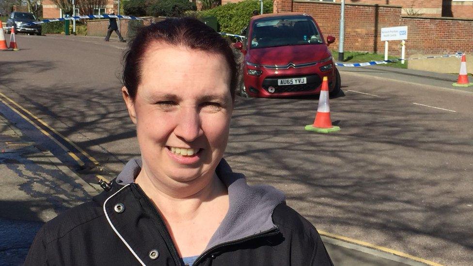 Sarah Larter standing in front of her stranded car