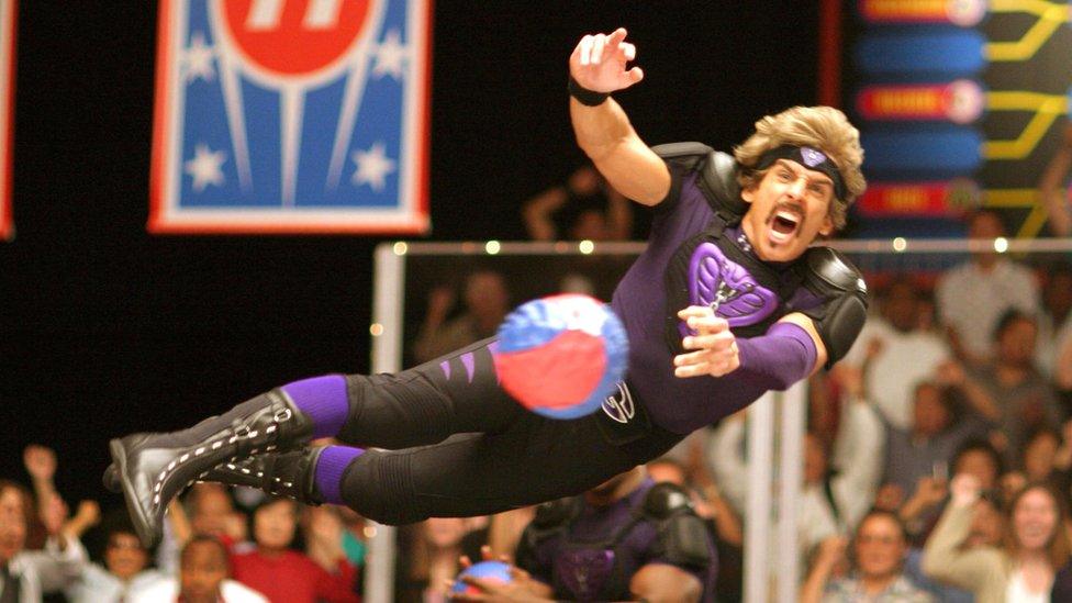 Ben Stiller in character as White Goodman , diving to catch a ball