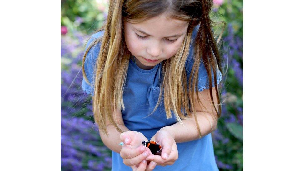 Princess Charlotte holding a butterfly