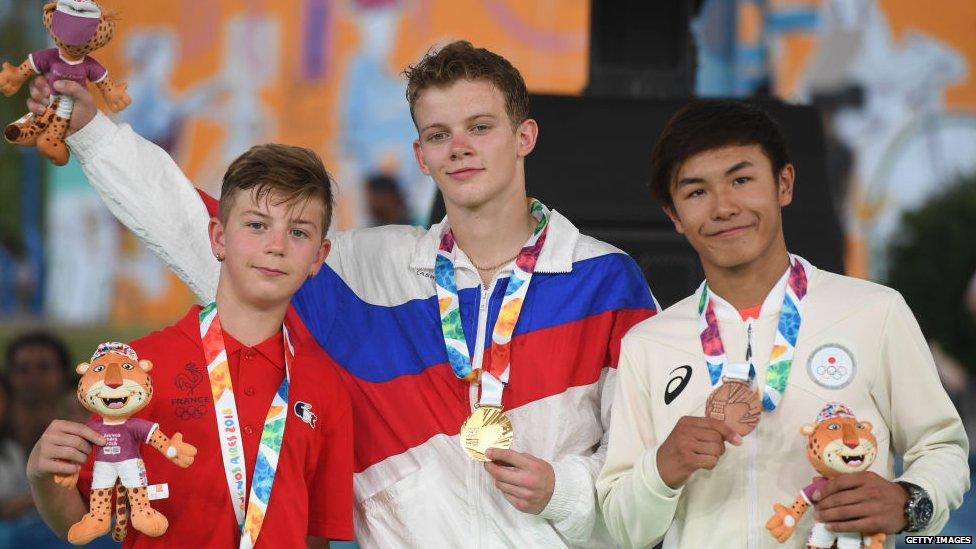 France's b-boy silver medal Martin, Russia's b-boy gold medal Bumblebee, and Japan's b-boy bronze medal Shigelix