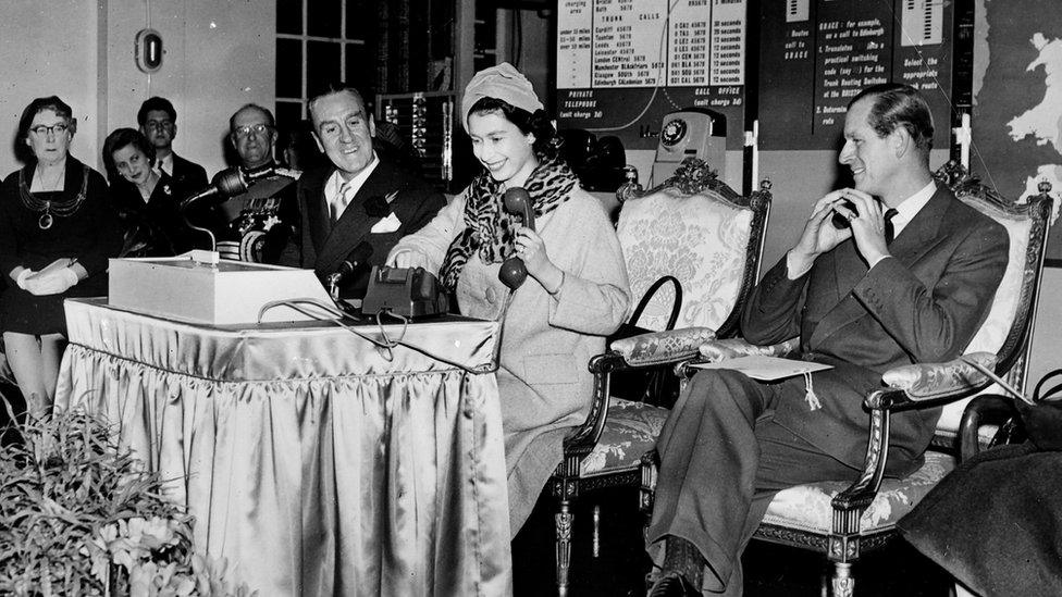 A black and white photo of the Queen and the Duke of Edinburgh