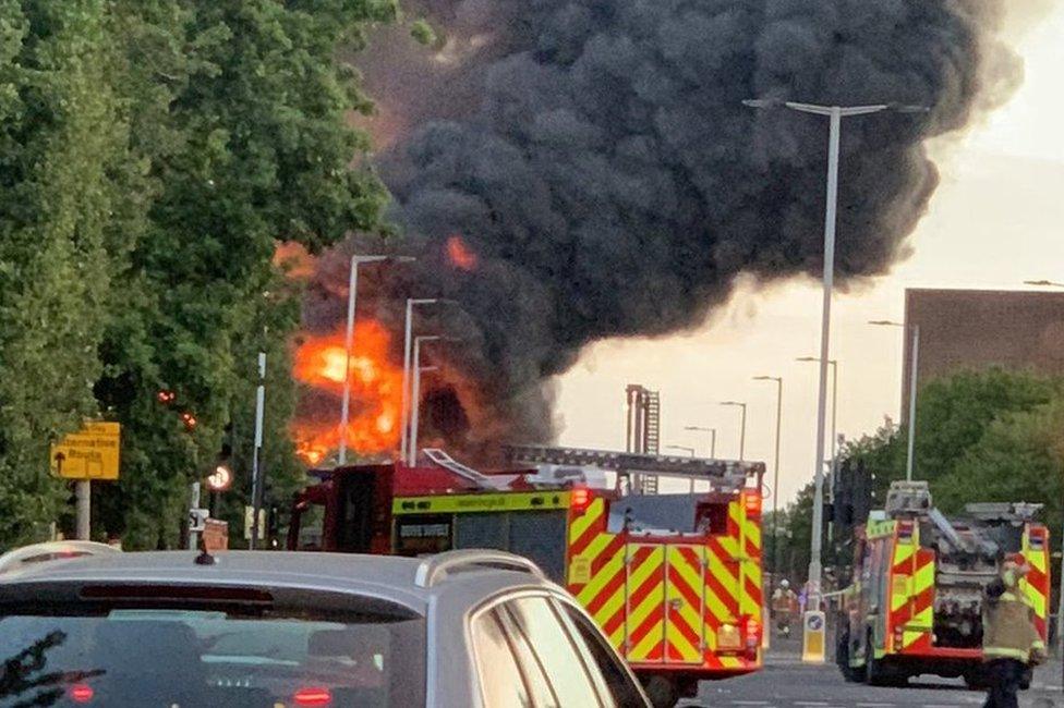 The blaze has created a huge plume of black smoke