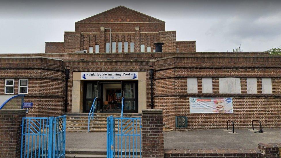 Image of the Jubilee pool brown brick building.