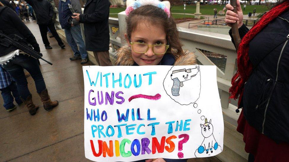 protester holds sign