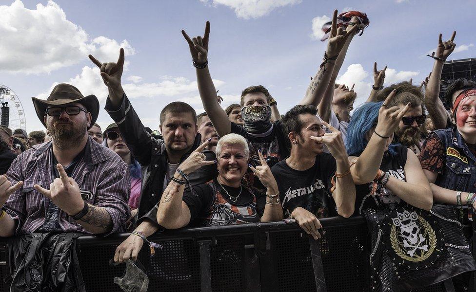 Fans pose for the camera at Download