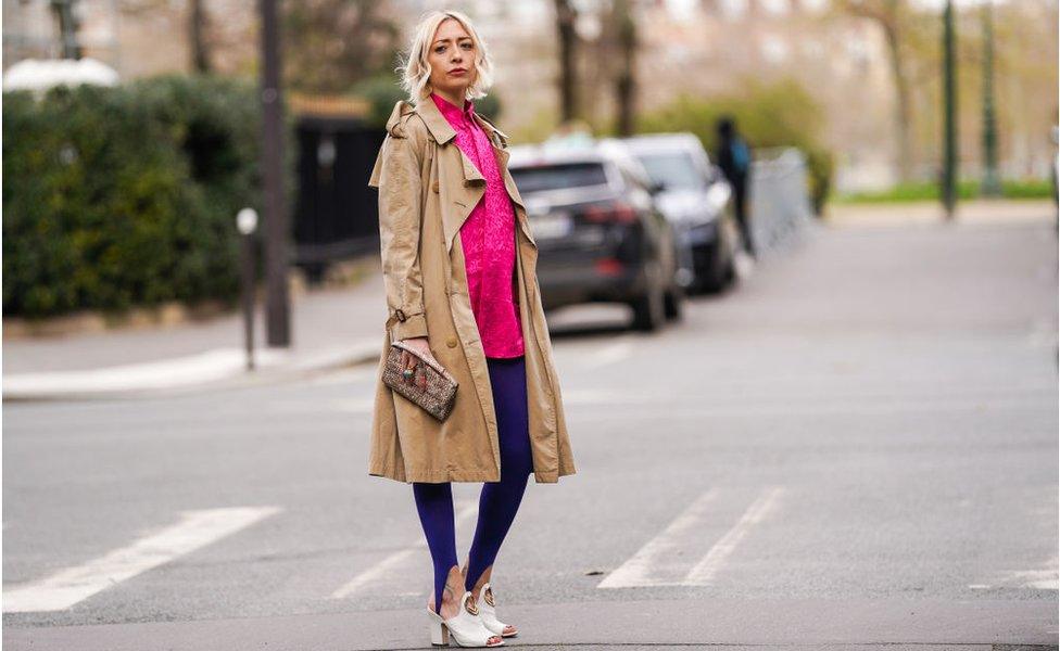 Model wearing a Burberry trench coat