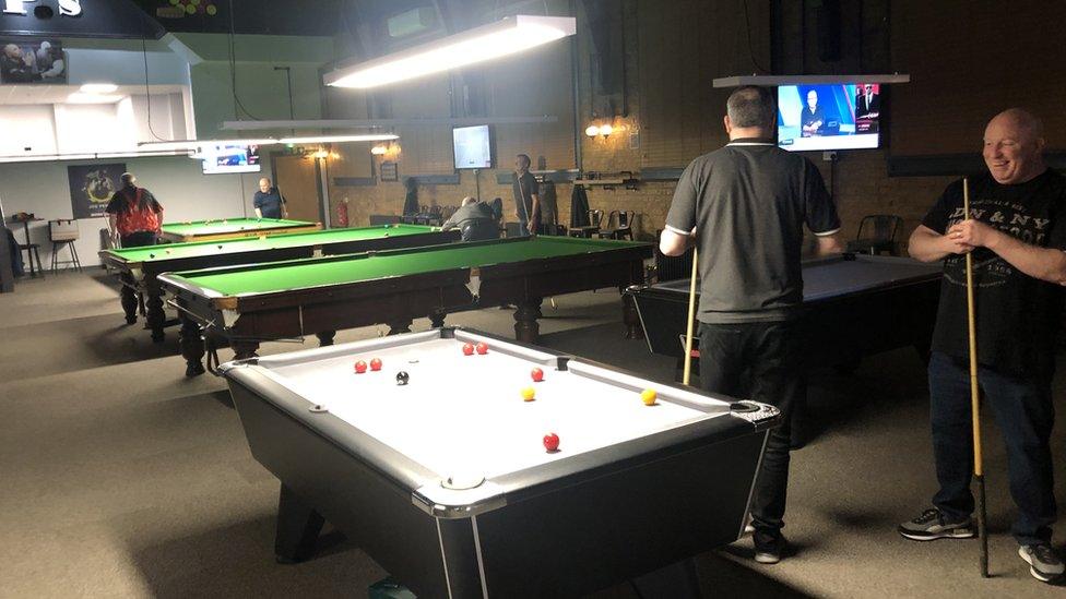 Pool and snooker tables inside the new club