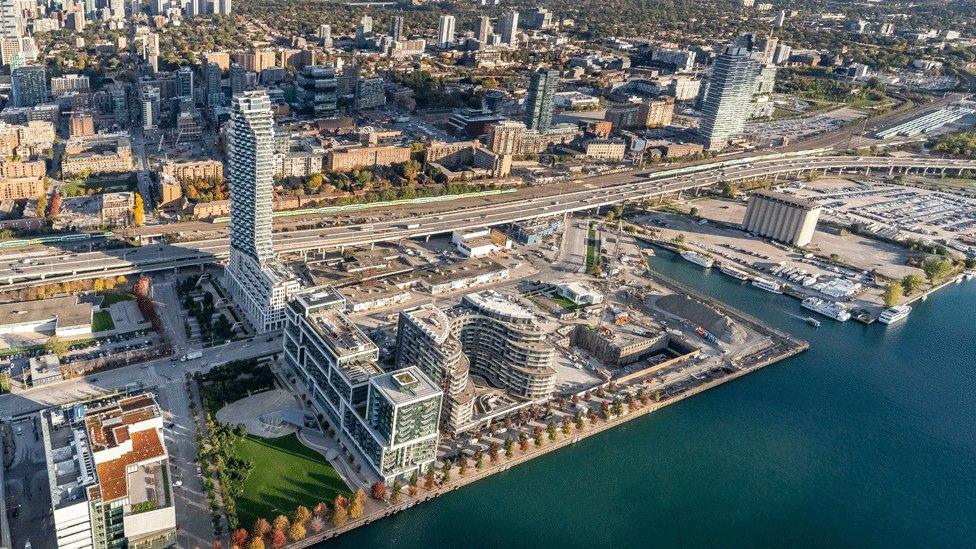 Aerial shot of Toronto with the waterfront land in front