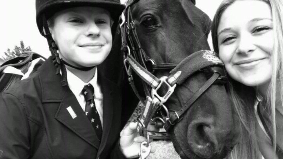 Scout and Ellie Gould with their horse Blackjack.