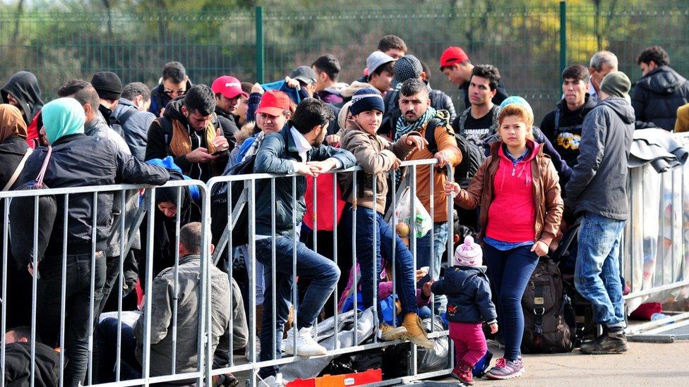 Migrants at a reception centre in Petisovci, Slovenia, on 18 October 2015