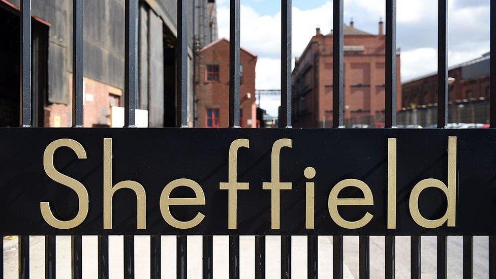 The word 'Sheffield' sits in the entrance gates to Sheffield Forgemasters International Ltd. in Sheffield, northern England