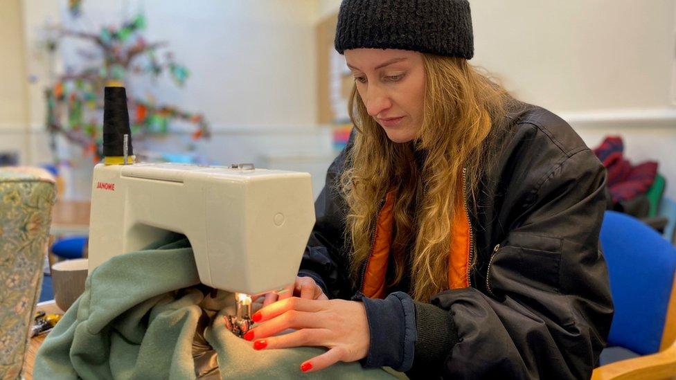 Louise Barker using a sewing machine