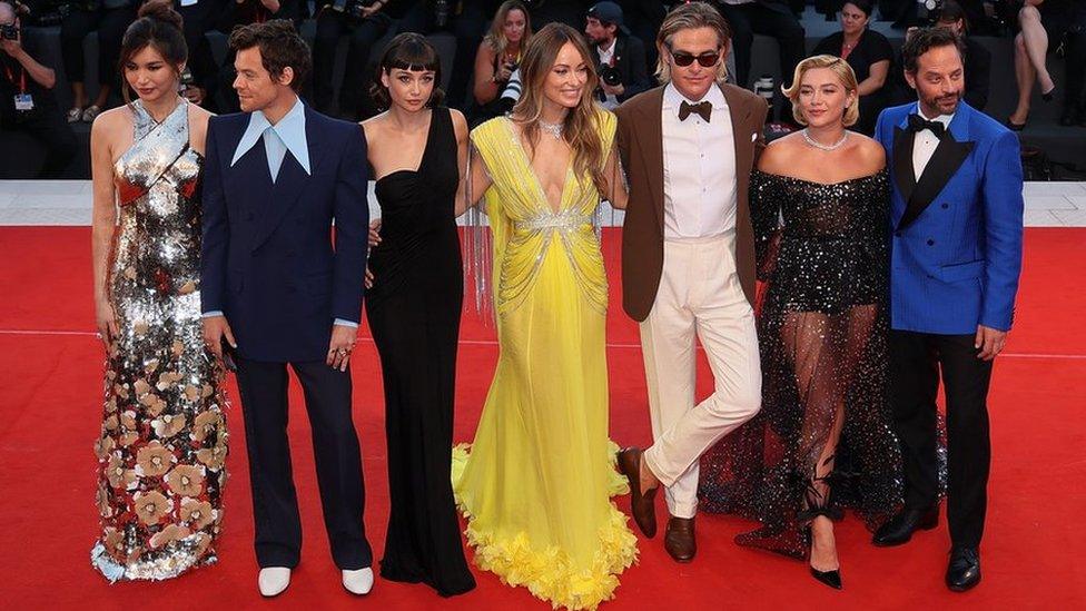 (Left to right) Gemma Chan, Harry Styles, Sydney Chandler, Olivia Wilde, Chris Pine, Florence Pugh and Nick Kroll on the red carpet ahead of the Don't Worry Darling screening at the Venice Film Festival