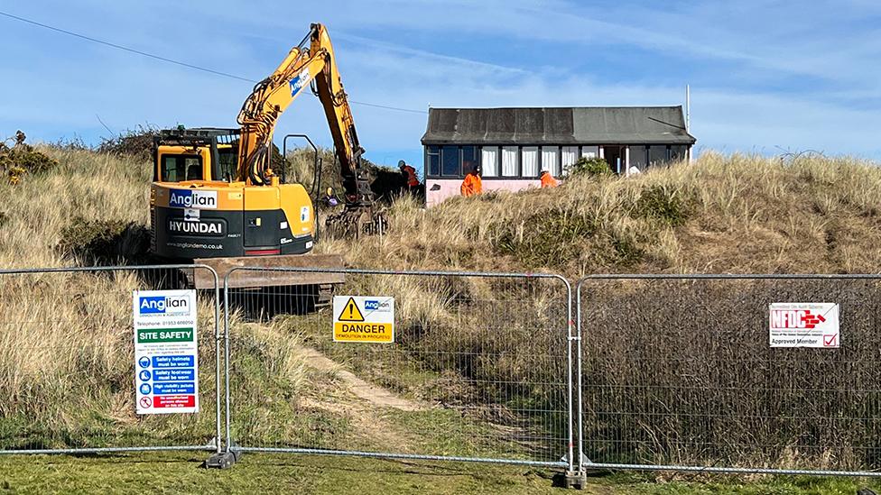 The demolition team at the site of Sue's home in Hemsby