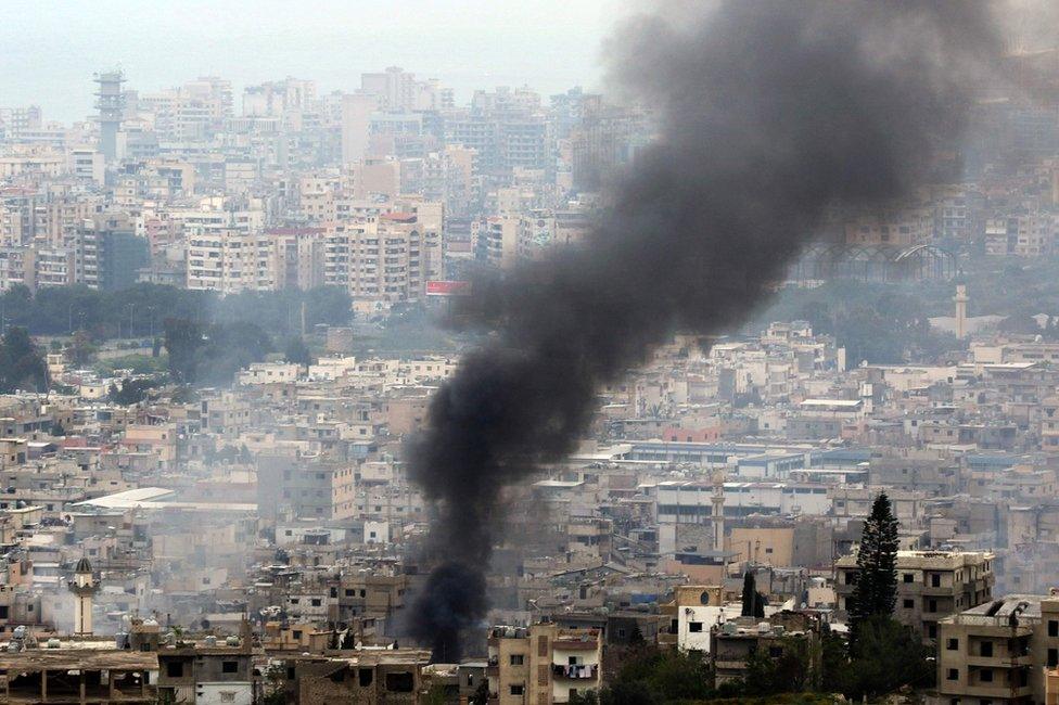 Smoke rises from the Ein el-Hilweh refugee camp in Lebanon during clashes on 9 April 2017