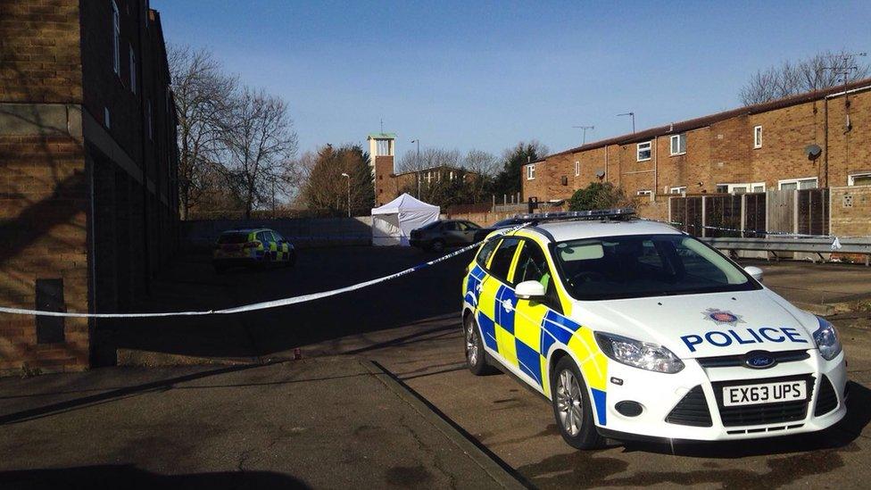 Police car and cordon