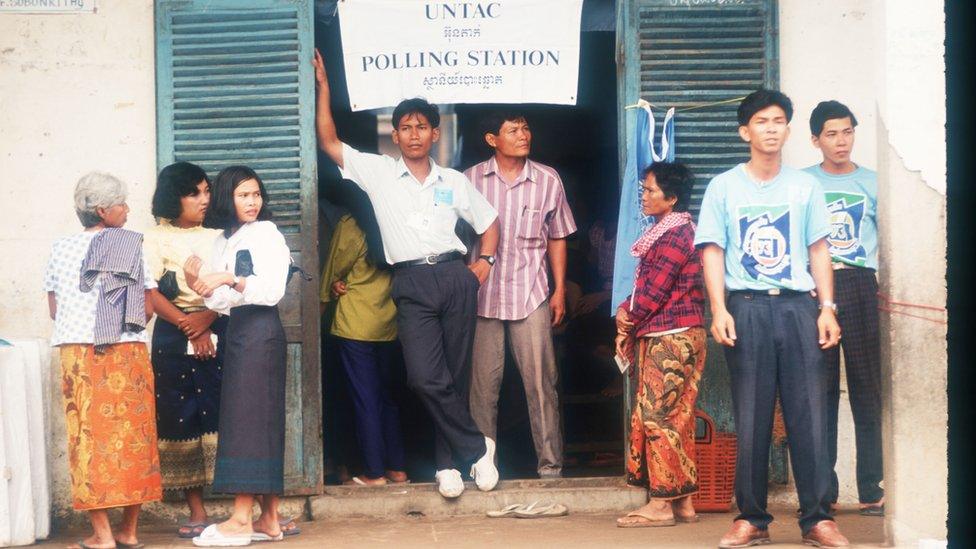 Unidentified people wait to vote in rural areas May 23, 1993 in Phnom Penh, Cambodia.