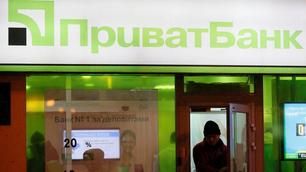 Man leaving a Privatbank branch