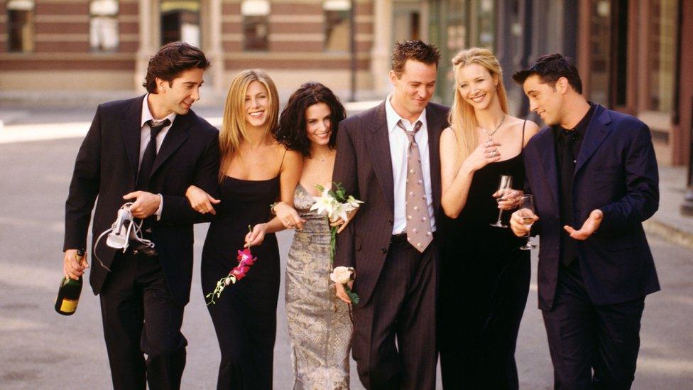 Cast of friends walk in promotional image