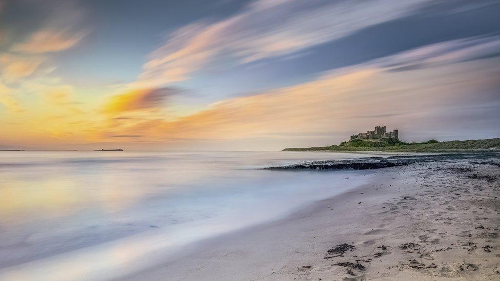 Sunrise over Bamburgh castle