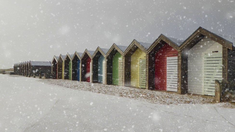 Beach huts in the snow