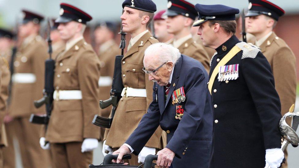 Captain Sir Tom Moore walking alongside junior soldiers