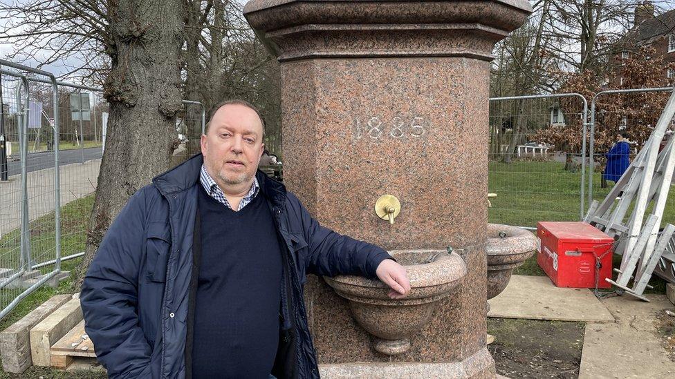 Peter Wanders next to the Hadley Green drinking fountain