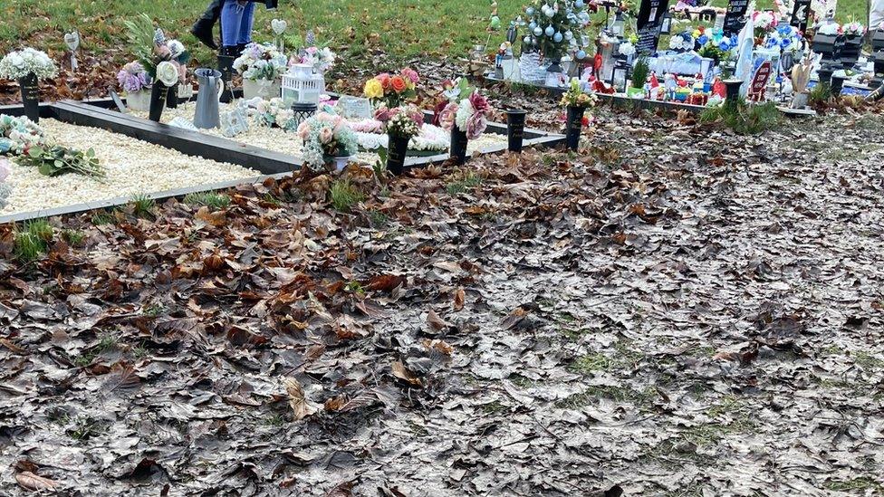 Mud around graves in cemetery