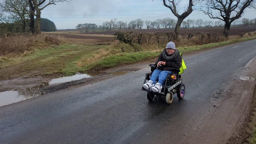 Adam Stanton-Wharmby driving his wheelchair