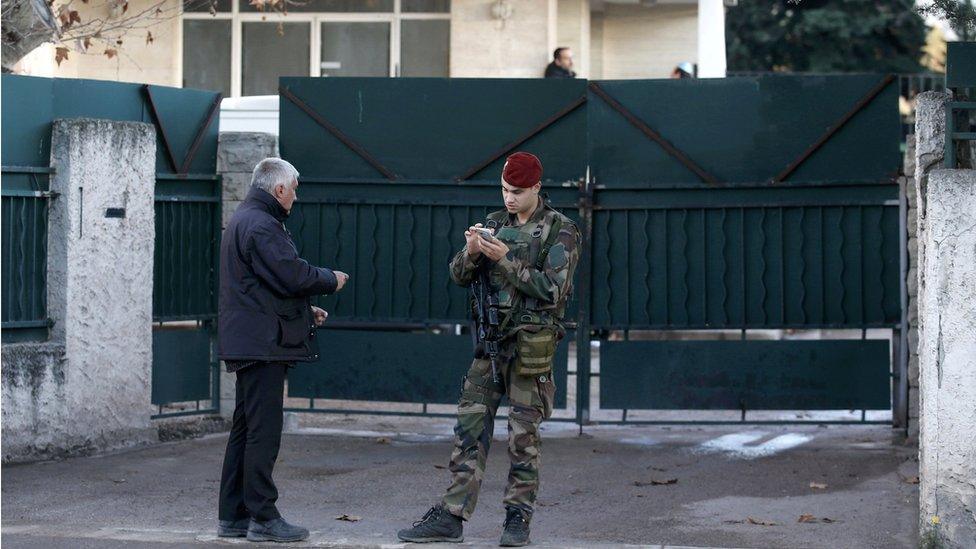 A French soldier secures the access to a Jewish school in Marseille's 9th district